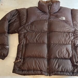The North Face brown Puffer Jacket. Stove sack. 700.  One repair